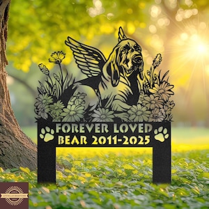 May include: Black metal garden stake featuring a Bloodhound dog with angel wings, surrounded by flowers. The text "FOREVER LOVED BEAR 2011-2025" is displayed below the dog, with paw prints on either side. The stake is designed for outdoor use.