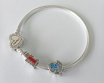 Set di charm Pandora Moments Keith Haring e bracciale a catena a serpente Radiant Heart