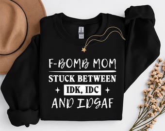 F-bomb Mom Stuck Between Idc Idk and Idgaf, Funny Sarcastic Mom Humor, Mom Life Png, New Mom Saying, Tired Mom Mother's Day Shirt Png Design