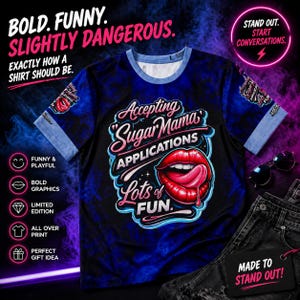 May include: A black and blue graphic t-shirt with the text "Accepting Sugar Mama Applications Lots of Fun" and a red lip graphic. The shirt has blue sleeves and a blue and white neckline. Sunglasses and jeans are also in the image.
