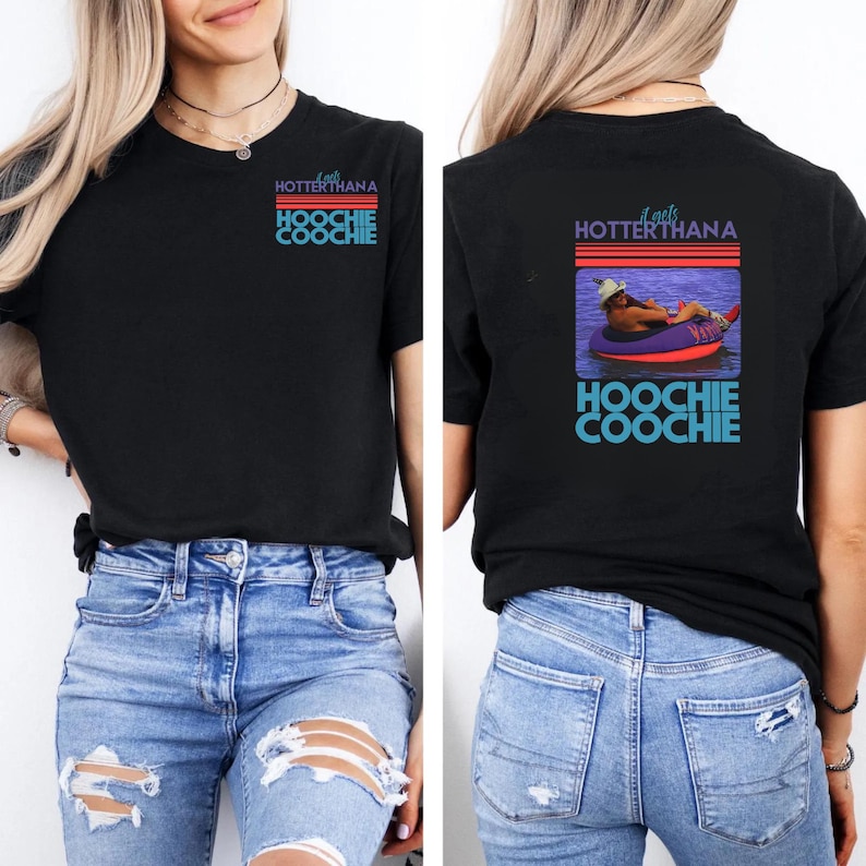 May include: Black t-shirt with the text "Looks Hotter Than A Hoochie Coochie" in red and blue. The back of the shirt features a graphic of a person in a tube on the water, with the same text.