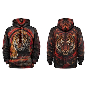 May include: A long-sleeve hooded sweatshirt featuring a full-body tiger graphic on the front and a large tiger face on the back. The design incorporates a dark black background with vibrant red and orange abstract circular patterns and white drawstrings.