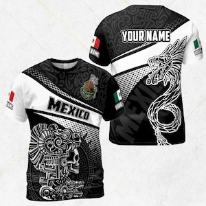 May include: A black and white t-shirt with a Mexican theme. The front features the word "MEXICO" and a detailed illustration of a skull and Aztec design. The back has a dragon design and the text "YOUR NAME". Includes Mexican flag details.