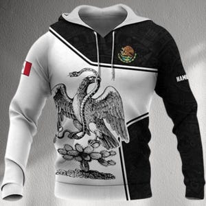 May include: A hooded sweatshirt featuring the Mexican coat of arms, with a black and white design. The left sleeve has a small Mexican flag. The right sleeve has the word "NAME" printed on it. The hoodie has a white and black color scheme.