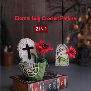 May include: Two crocheted tombstone decorations with red lilies and green accents. One tombstone is in a green crocheted pot with a white spiderweb design, and the other hangs by a black string. Text reads: Eternal Lily Crochet Pattern 2 IN 1.