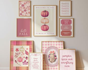 May include: A gallery wall set of nine framed art prints in shades of pink and cream. The prints feature pumpkins, a ghost, plaid and striped patterns, and text including Welcome to the Pumpkin Patch, Hello Fall, and Pumpkin Spice and Everything Nice.