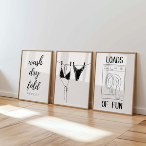 May include: A white ceramic mug with a black handle and the text "But First, Coffee" in a bold, black font. The mug is set against a blurred background, suggesting a cozy setting.