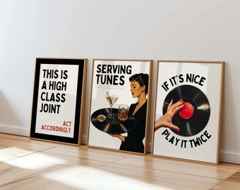 May include: Three framed art prints with retro-style designs. One print reads "THIS IS A HIGH CLASS JOINT" and "ACT ACCORDINGLY". Another says "SERVING TUNES". The third print features a vinyl record and the text "IF IT'S NICE PLAY IT TWICE".