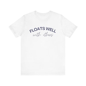 White fleece sweatshirt with navy lettering, styled casually for brunch after a pool day or float adventure.