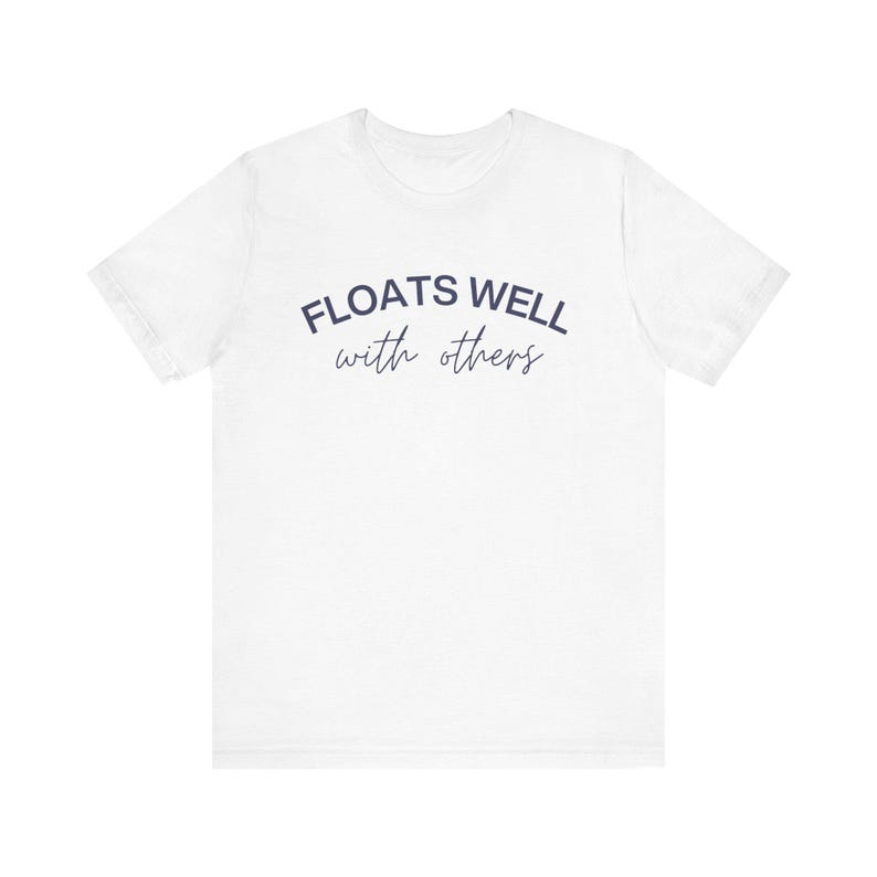 White fleece sweatshirt with navy lettering, styled casually for brunch after a pool day or float adventure.