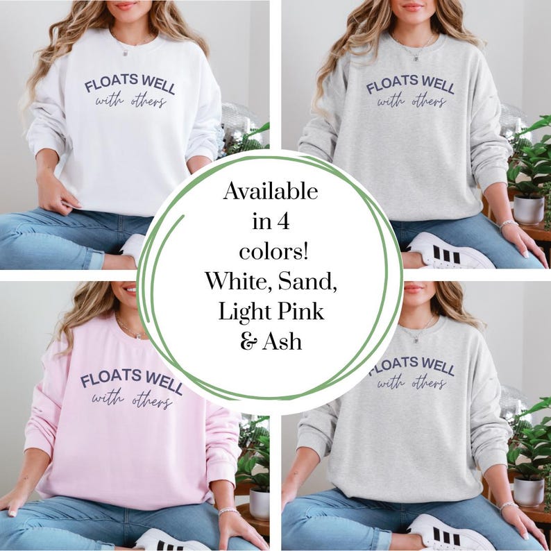 Cozy fleece crewneck with navy script print, styled for warm weather layering, float brunch, or lake house lounging.