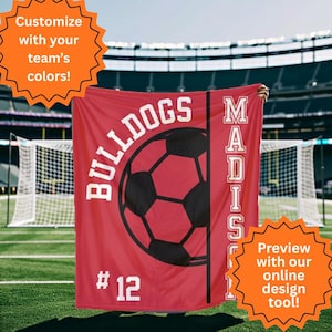 May include: A red soccer blanket with the word "BULLDOGS" and a black soccer ball graphic. The blanket also features the name "MADISON" and the number "12". The text "Customize with your team's colours!" and "Preview with our online design tool!" are also visible.