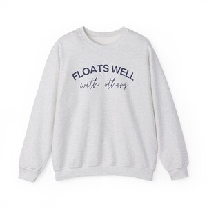 Heather grey float tee styled for casual summer days, poolside hangouts, and floating with friends.