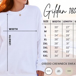 Cozy fleece crewneck with navy script print, styled for warm weather layering, float brunch, or lake house lounging.