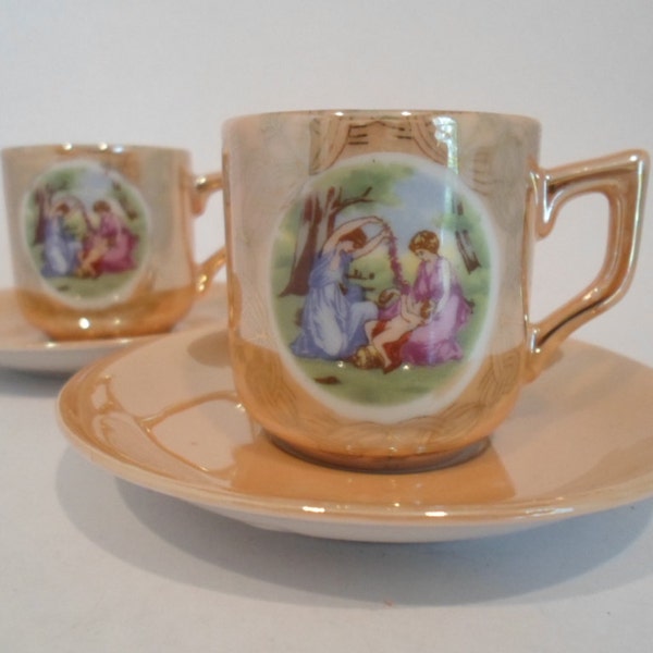 Vintage SET OF 2  Demitasse Little cups and saucers Golden Peach Color with Tiny Scene of Women Dancing with Flowers VIctorian STyle