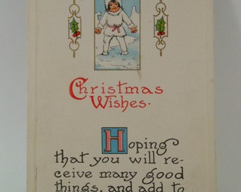 Antique 1915 Christmas Postcard with little girl in white fur and snow with green one cent postage stamp