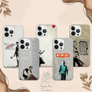 May include: Five phone cases with graffiti art designs. One case features the text "FOLLOW CANCELLED DREAMS". Another shows a girl with a red balloon. One case has the text "IF YOU WANT TO ACHIEVE GREATNESS STOP ASKING FOR PERMISSION".