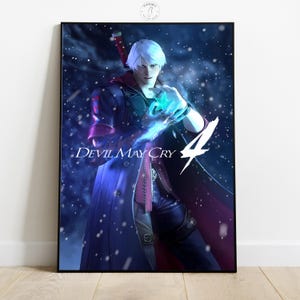 May include: A framed poster featuring a character from Devil May Cry 4. The character has white hair and is wearing a long, dark coat with red accents. The poster has the game's logo and a blue and purple color scheme.
