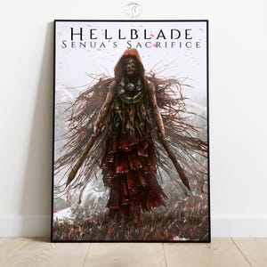 May include: A framed poster featuring the game title "Hellblade: Senua's Sacrifice." The artwork depicts a figure in a red hooded cloak holding two weapons, set against a misty, mountainous backdrop. The poster is framed in black.
