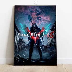 May include: A framed poster featuring the "Devil May Cry 5" video game. The artwork depicts a character with a sword and wings, set against a backdrop of a destroyed city and a dark, ominous sky. The game's title is prominently displayed.