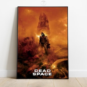 May include: A framed poster featuring a science fiction scene with a figure in a spacesuit standing in a fiery, desolate landscape. The poster has the words "DEAD SPACE" in white block letters at the bottom. The color palette is dominated by shades of orange and brown.
