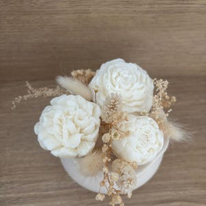 Bouquet of scented candles and melts in a Jesmonite pot with dried flowers