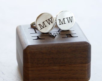 May include: A pair of silver cufflinks with the initials "MW" engraved on each, in a wooden box with the name "Matt" engraved on the lid.