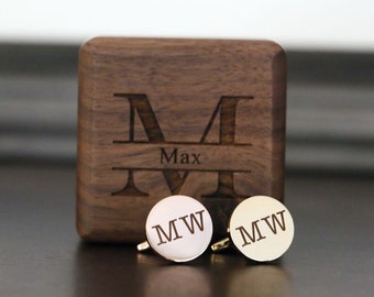 May include: Gold cufflinks with the initials "MW" engraved on each cufflink. The cufflinks are in a wooden box with the initial "M" and the name "Max" engraved on the box.