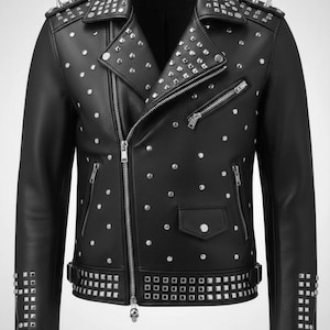 May include: Black leather jacket with silver studs and zippers. The jacket features a notched collar, multiple pockets, and a studded design on the shoulders, cuffs, and waist. The jacket has a skull zipper pull and a classic biker style.
