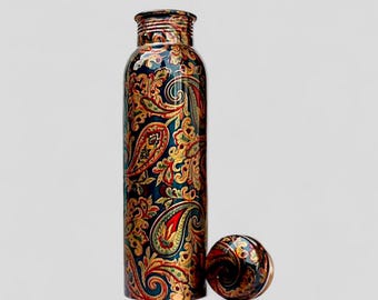 May include: A tall, patterned water bottle with a matching cap. The bottle features a detailed paisley design in red, gold, and green on a dark blue background. The cap is placed next to the bottle. The bottle is approximately 10 inches tall.