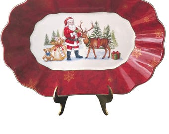 Bol de servir navideño festoneado con diseño de Papá Noel de fantasía de Villeroy & Boch, color rojo.