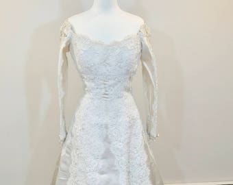 A stunning wedding dress by Carmela Sutera size 2