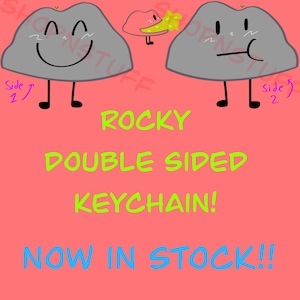 May include: A double-sided keychain featuring a cartoon rock character with a smiling face on one side and a neutral expression on the other. The keychain is gray with black details and the text "ROCKY DOUBLE SIDED KEYCHAIN! NOW IN STOCK!!" on a pink background.