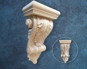 May include: A carved wooden corbel with an ornate, scroll-like design. The corbel features detailed leaf and scroll patterns, and a rectangular top. A smaller, inset image shows a similar corbel. The wood has a natural, light color.
