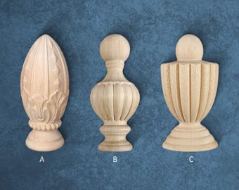May include: Three unfinished wooden finials in different shapes. The finials are labeled A, B, and C. Finial A is an elongated, carved design. Finial B has a bulbous shape with a ball on top. Finial C is a vase-like shape.