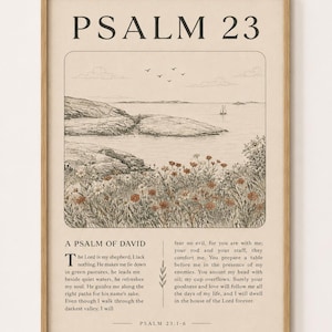 Może przedstawiać: Oprawiony wydruk ścienny z napisem PSALM 23 u góry, rysunkiem liniowym krajobrazu przybrzeżnego z kwiatami na pierwszym planie oraz pełnym tekstem Psalmu 23:1-6 wydrukowanym czarnym tuszem na jasnobeżowym tle w drewnianej ramie.