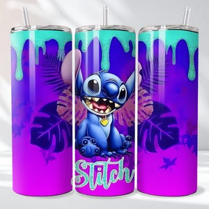 May include: A tumbler featuring a vibrant design with a cartoon character. The tumbler has a teal top with dripping paint effect, a purple and pink gradient background, and a blue character with the word "Stitch". Includes a straw.