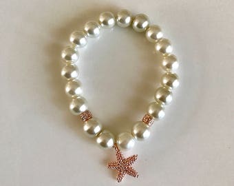 Golden rose jewelry, ivory pearl flower girl bracelet with rose gold starfish charm, flower girl jewelry, bridal jewelry, wedding gifts