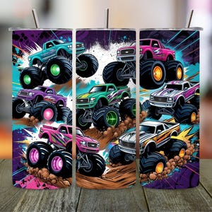 May include: A set of three stainless steel tumblers featuring colorful monster truck designs. Each tumbler showcases a different truck in vibrant colors like teal, pink, and green, with large black tires and detailed graphics. The background has a dynamic, comic-book style.