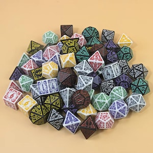 May include: A pile of multi-coloured polyhedral dice, including white, yellow, green, purple, and brown. The dice are of various shapes, such as D4, D6, D8, D10, D12, and D20, with numbers and symbols. Suitable for tabletop games.