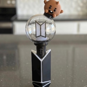 May include: A rustic wooden sign with the text "Welcome to our home" in white lettering. The sign has a distressed finish and a simple, inviting design, ideal for entryway decor.