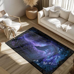 May include: Rectangular rug with a wolf silhouette set against a swirling galaxy design in purple, blue, and white. The rug has a black border with floral and geometric patterns. The rug is designed to add a decorative touch to the room.