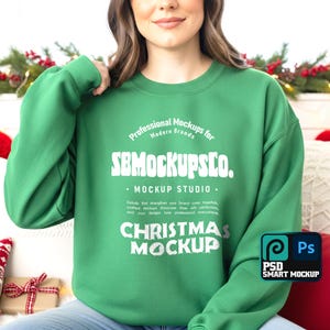 May include: A green crew neck sweatshirt with white text that reads "Professional Mockups for Modern Brands" and "SBMOCKUPSCO. MOCKUP STUDIO." The words "CHRISTMAS MOCKUP" are also visible. A "PSD SMART MOCKUP" logo is in the bottom right corner.