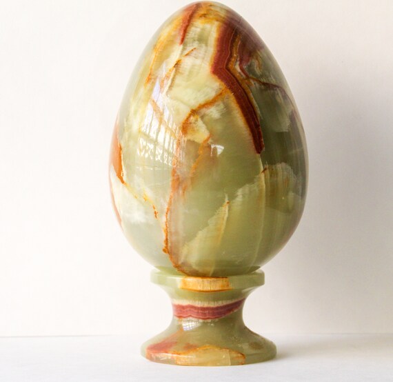Green onyx egg smooth polished with stand.