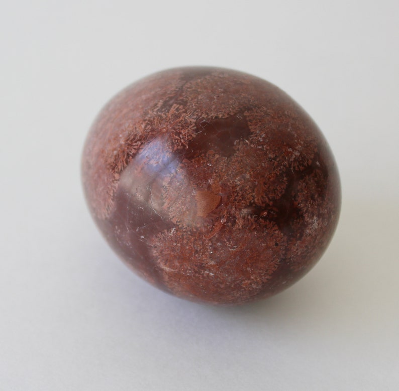 Vintage Brown Marble Stone Egg And Stand With Mirror.
Brown Marble Egg and Lucite Stand and 4-Inch Octagon Mirror. 
The Egg Has a Smooth, High Polish Finish.
The Stand is Clear Lucite.
Egg and Stand Measure 4 Inches.
The Gemstone Egg is 2 3/4 Inches by 2 Inches.
One More Really Nice Egg For your Collection.