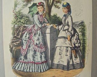 May include: Two women in fashionable dresses from the 1800s. One woman is wearing a white dress with black stripes and a blue hat. The other woman is wearing a white dress with red and pink trim and a white hat. Both women are holding parasols.