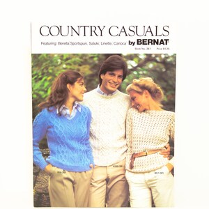 May include: A knitting pattern book cover featuring three people wearing sweaters. The book is titled "Country Casuals" by "Bernat". The book number is 261 and the price is $1.25.