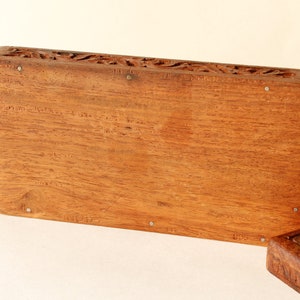 Wood Dresser Box Hand Carved Mahogany Box Lined Vintage 1960s.
Rich Hand-Carved Mahogany Dresser Box Featuring Brass Handles and Green Fabric Lining. 
The Lining is Very Old and Thin.
Wood Box Measures 6 7/8 Inches By 4 Inches By 1 1/2 Inches Tall.