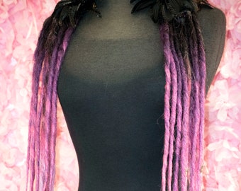 Dread Lock hair falls in transitional black to hot pink