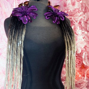 Dread Lock hair falls in transitional black to grey